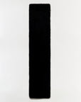 A long, narrow black fuzzy rectangular scarf, shown vertically against a plain white background.