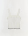 White crop top on a light gray background