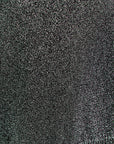 Close-up of a textured black fabric surface