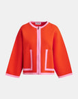 Orange jacket with pink accents on a white background