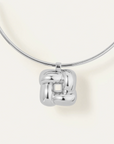 Chrome wall-mounted light fixture on a white background