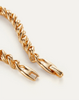 Gold chain bracelet with clasp on a light background