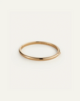 Gold bracelet on a white background