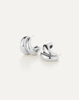 Pair of silver hoop earrings on a white background
