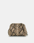 Snakeskin patterned handbag on a light beige background