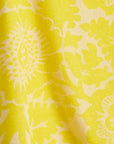 Close-up of yellow fabric with floral pattern