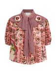 A women's short-sleeve blouse featuring a pink floral print on the body, a red and white gingham pattern on the yoke and collar, and a matching red and white gingham tie at the front, displayed on a clean white background.