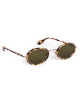 Sunglasses with gold accents on a light gray background
