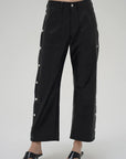 Black wide-leg pants with button details on a white background front view