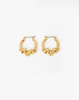 Gold hoop earrings on a white background