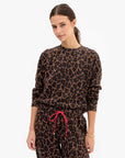 model wearing a matching leopard print sweatshirt set