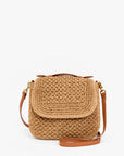 Brown woven handbag with leather straps on a white background