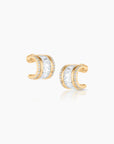 Gold earrings on a white background
