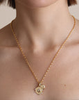 2mm Italian Chain Link Necklace with a pendant on a person's neck against a neutral background