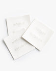Three white labels with 'MOTHER SUPERIOR' text on a white background