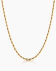 Gold chain necklace on a white background