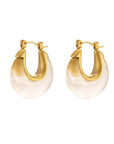 Gold hoop earrings with clear resin on a white background