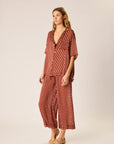 Woman wearing Lauren Pant Polka Dot on a beige background