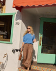 Lauren Pant front view on model walking out of store