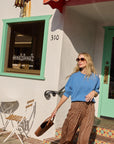 Lauren Pant front view on model swinging purse while walking