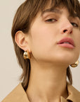 Paige Puff Earrings front view on model