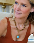Odyssey Necklace in Baby Blue front view on model slightly leaning forward
