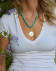 Semi-Precious Odyssey Necklace front view on model on Mother of Pearl side