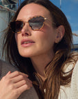 Bella 18k + Venezia Sunglasses on model with average, square face shape