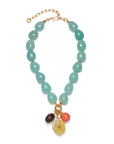 Beaded necklace with charms on a white background