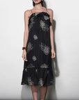 model wearing the Paige Layered Ruffle Midi Dress with strappy sandals on a white background, front