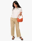 Petite Moyen Messenger Saltillo Diagonal Woven on arm, full body view