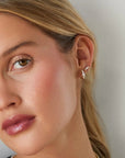 Single Graduated Diamond Bar Chain Stud Earring on ear in second hole