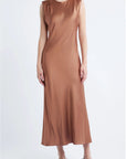 model wearing a cinnamon colored sleeveless midi dress on a white background