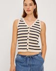 model wearing stripe vest top with denim bottoms on a white background
