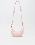 Pink handbag with a strap on a light gray background