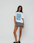 model wearing beachside summers short sleeve tee with stripe shorts on a white background
