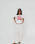 Hotel De La Lune Ringer Tee full body front view on model with hands grabbing bottom of shirt