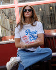 Park City Dinner Everyday Tee front, model's arms crossed