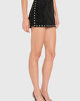 Model wearing black skirt with studs on White background