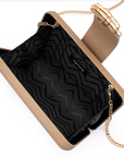 Beige handbag with black interior and gold chain strap on a white background