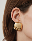 Rue Earrings Gold close up on ear