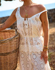 Woman in Yaya Lace Cami holding a woven basket outdoors.