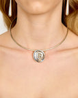 model wearing the spira silver necklace