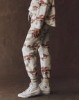 The Stadium Sweatpant in riding horses print side