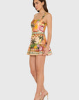 model wearing the april print romper on a white background, side