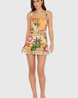 model wearing the april print romper on a white background