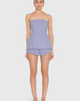 model wearing a strapless top and short set in blue and ivory stripes