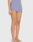 model wearing blue and ivory striped shorts on a white background, side