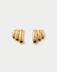 Pair of gold hoop earrings on a light gray background