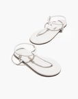 Tubular Mariana Sandals in White partial aerial view with shoes in zig zag formation on white background